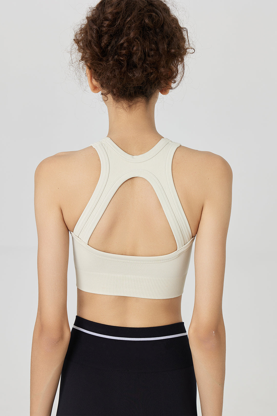 Made from jacquard stretch fabric, this seamless racerback bra feature mesh  detail and a logo-embroidered elastic band to help keep every